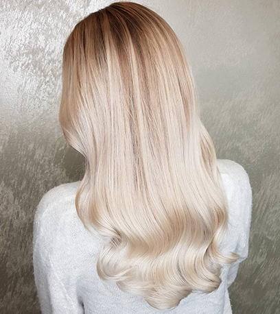 Back of wavy mother of pearl hair, created using Wella Professionals