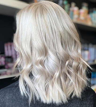 Back of womans head with ice pearl blonde hair