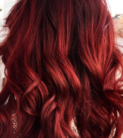 Rich red velvet hair color, created using Wella Professionals