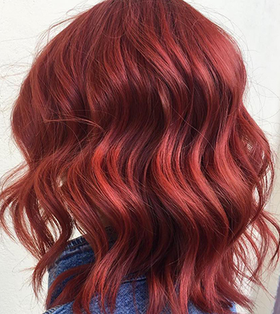 Powdery red hair color, created using Wella Professionals