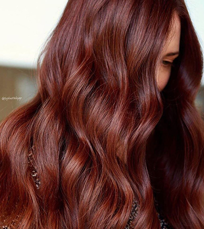 Deep red hair color, created using Wella Professionals