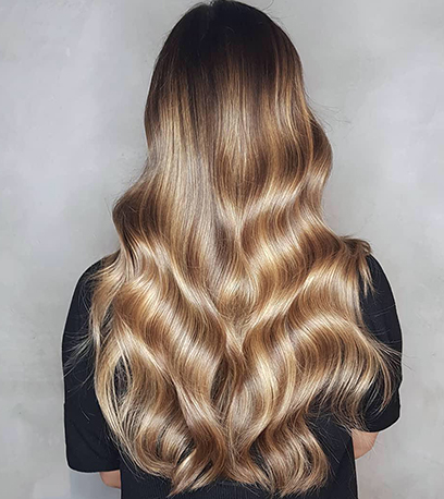 Creamy toffee blonde hair, created using Wella Professionals